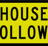 Yellow sign with a black border reading 'HOUSE FOLLOWS' in bold letters