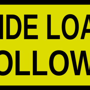 Yellow rounded-corner warning sign that reads 'WIDE LOAD FOLLOWS'