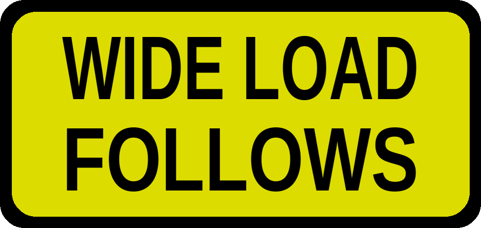 Yellow rounded-corner warning sign that reads 'WIDE LOAD FOLLOWS'